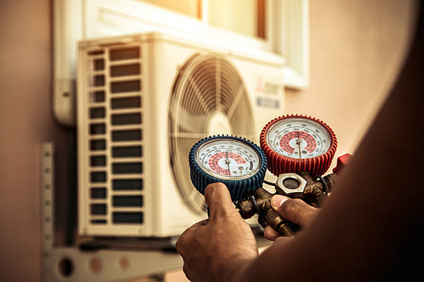 Professional Air Conditioning Service technician working in Deedsville, IN